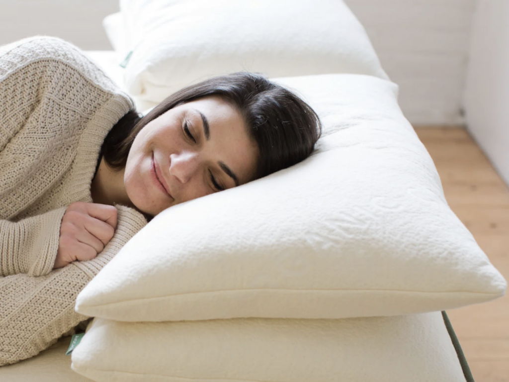 Woman laying on a avocado green pillow